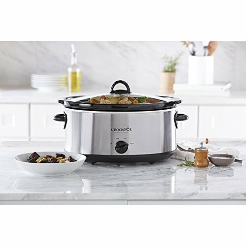 Slow cooker on a kitchen counter with food.