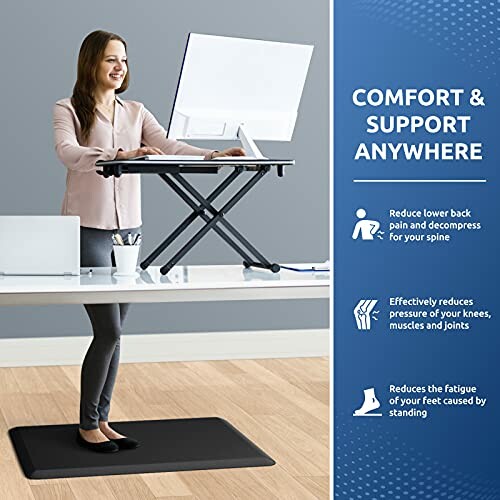 Woman using a standing desk with a comfort mat and ergonomic benefits listed.